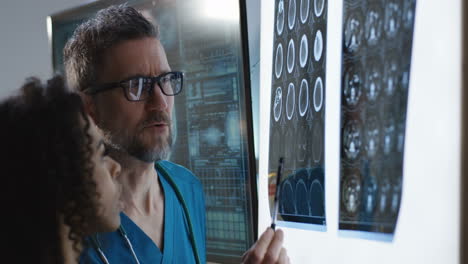 medical professionals reviewing brain scans