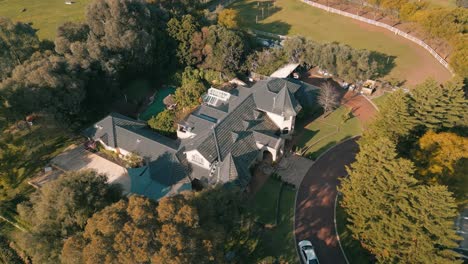 drone footage of an estate house during sunset 4k 25fps