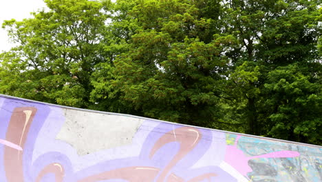 Young-skateboarder-skating-the-outdoor-skatepark