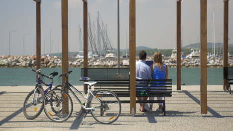 couple with digital tablet on waterfront