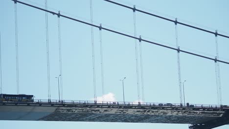 view of a cable-stayed bridge underside with traffic
