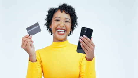 phone, credit card and face of woman in studio