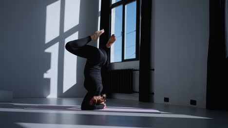 woman doing yoga in a studio