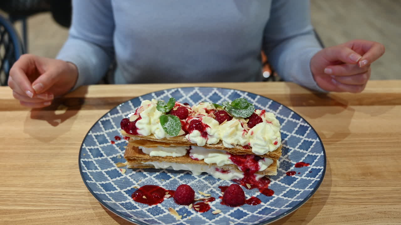 Millefeuille dessert at a restaurant in a blue plate