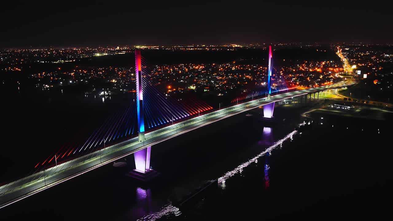 Colorful Lights At Heroes Of Chaco Bridge At Nighttime In Paraguay, South America. Aerial Drone Shot