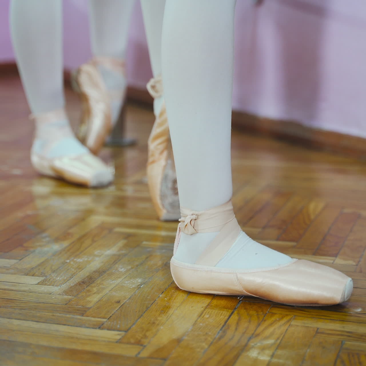 Close-up of ballerina feet in pointe shoes. Woman's feet in pointe shoes. Dancing ballet elements.