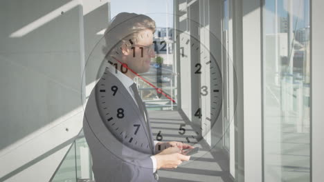 clock animation over businessperson holding smartphone in modern office hallway