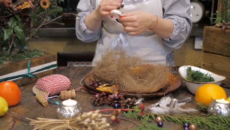 florist at work. how to make christmas wreath with floral arrangement. step by step, tutorial