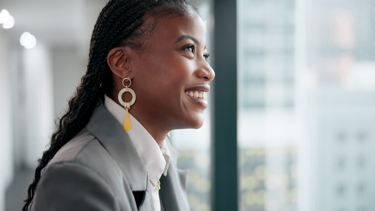 Portrait of a confident businesswoman looking out the window