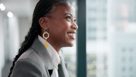 portrait of a confident businesswoman looking out the window