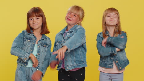 three cute girls friends smiling excitedly and pointing to camera choosing lucky winner indicating