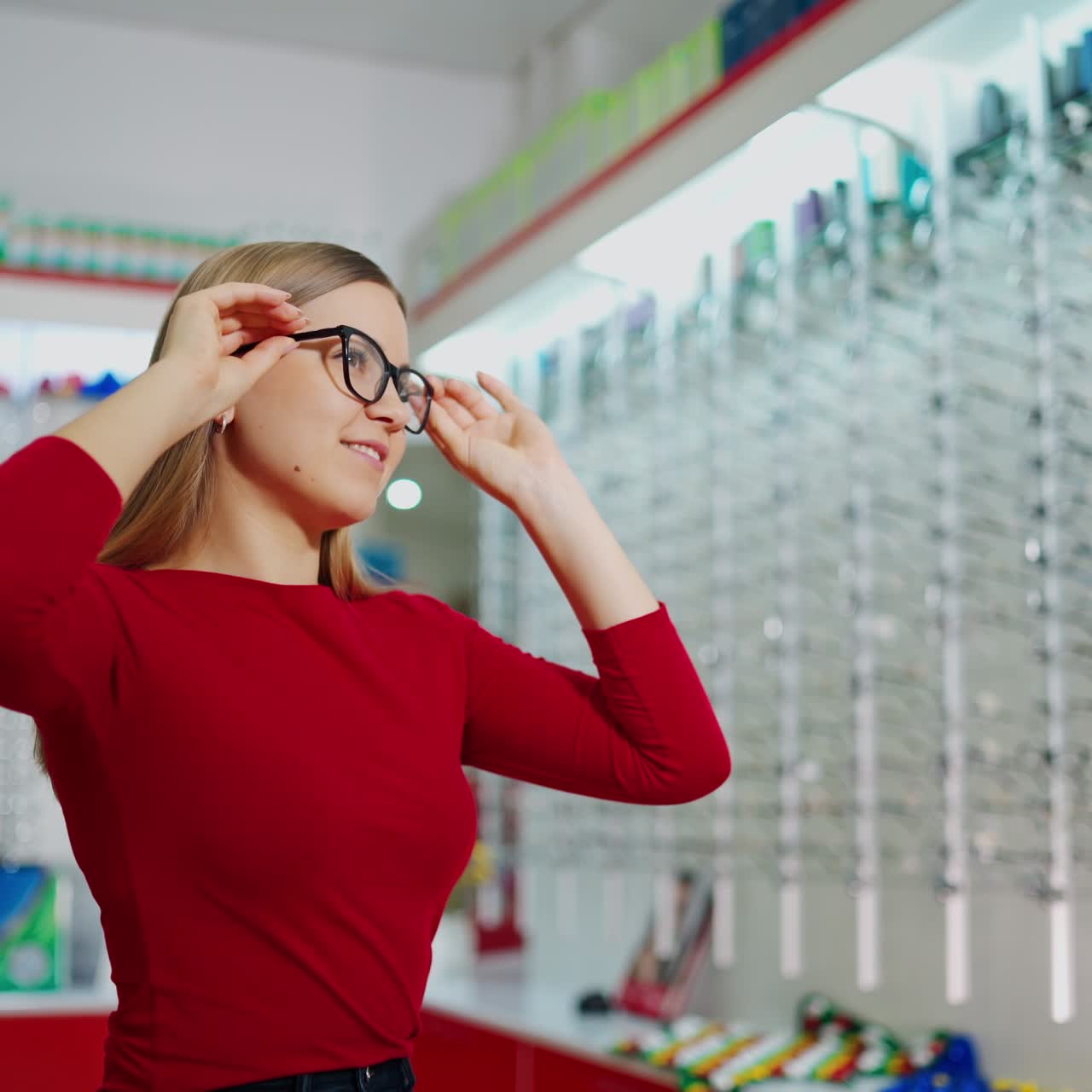 Woman examining eyeglasses