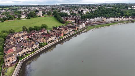 aerial view of riverfront houses and town
