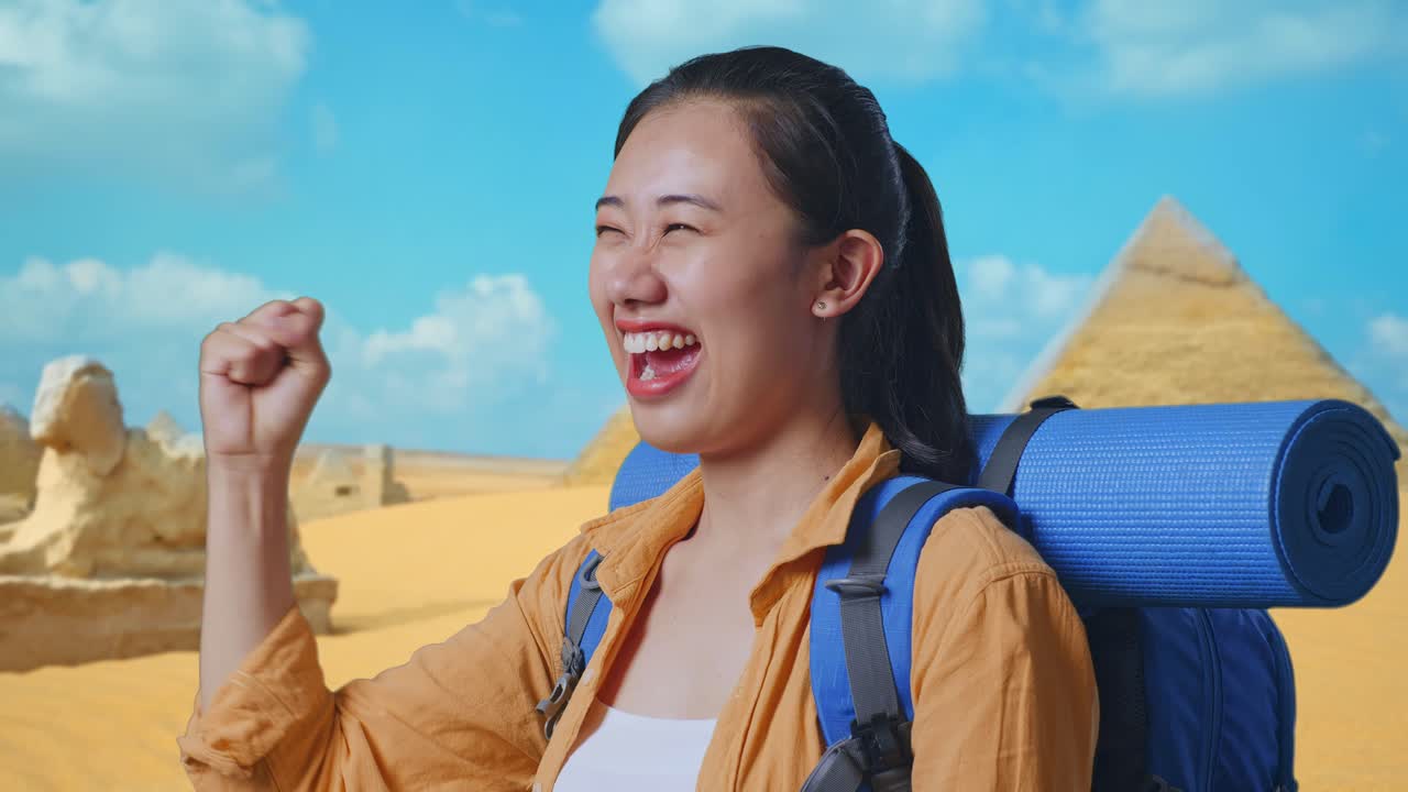 Close Up Side View Of Asian Female Hiker With Mountaineering Backpack Screaming Goal Celebrating The Success While Traveling In Pyramid Of Giza