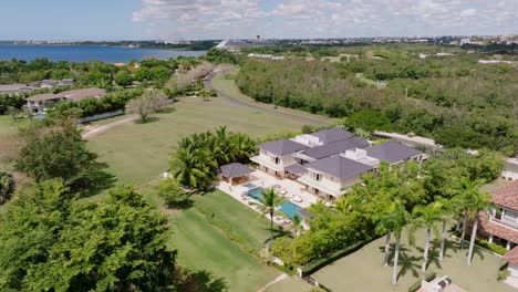 luxury villas in exclusive context, casa de campo, la romana in dominican republic. aerial drone orbiting