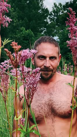 man in a field of flowers