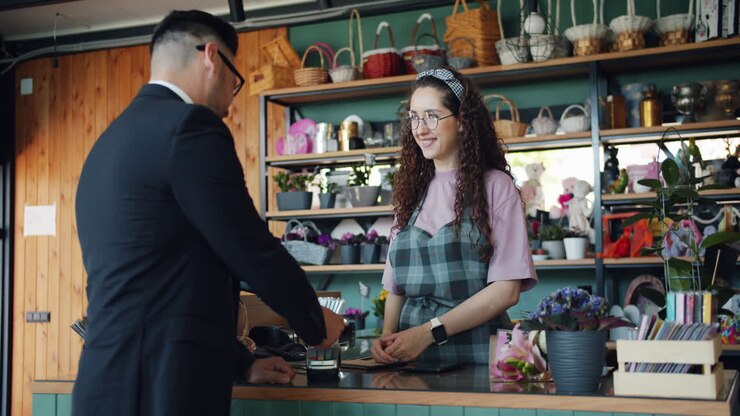 Customer purchasing flowers at a flower shop