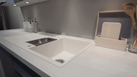 a kitchen showroom gimbal shots of bench and faucet