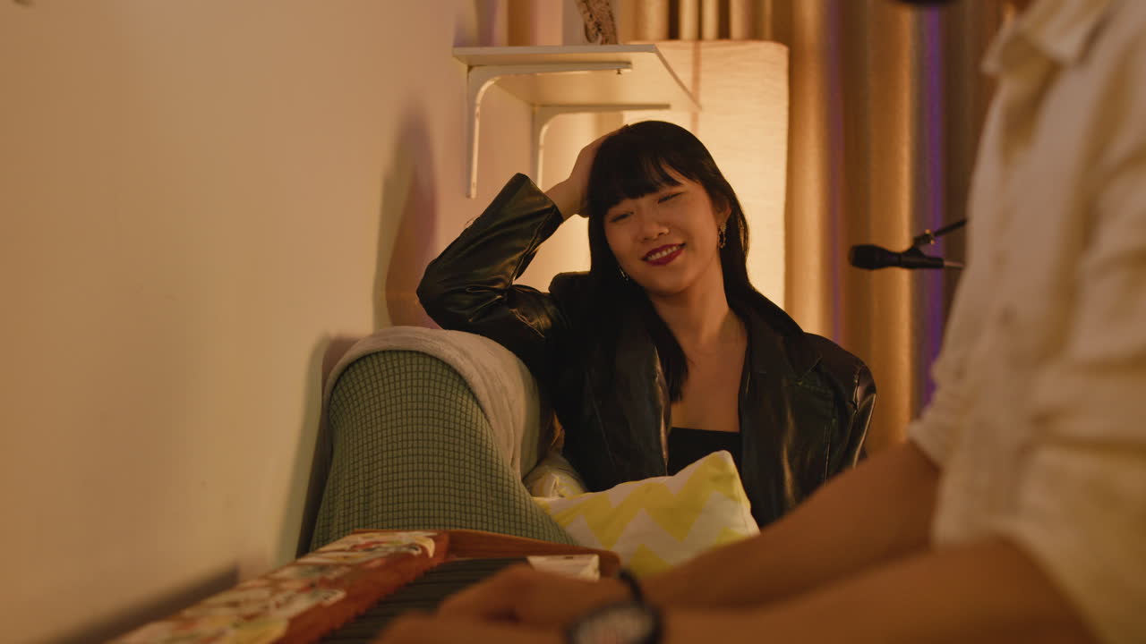 A woman listening to music on the piano