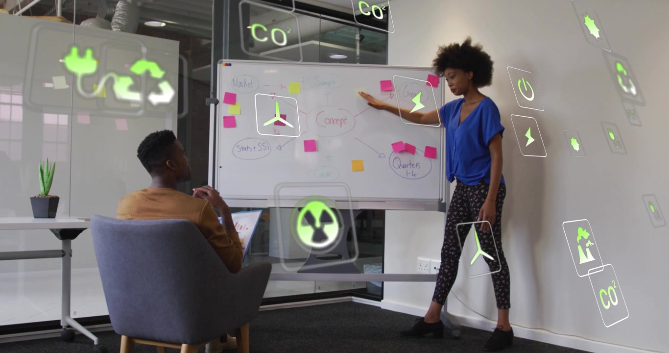 Presenter raising hand and pointing at lightning bolt, highlighting floating environmental icons