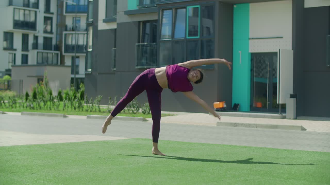 Woman Performing Handstand Acrobatics Outdoors