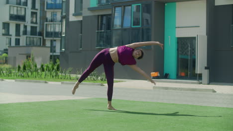woman performing handstand acrobatics outdoors