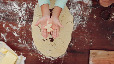 Hands,-baking-and-kid-with-shape-in-top-view