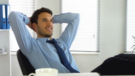 businessman relaxing while at work