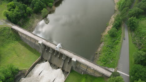 reflections in the water of nimrod lake and dam in arkansas, usa