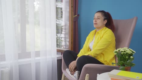 Christian-woman-praying-in-front-of-the-window.