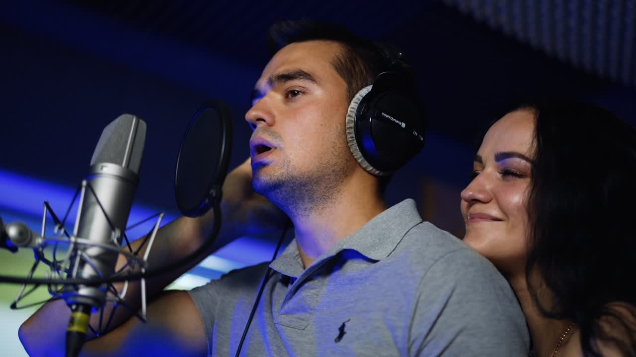 Couple Singing in Recording Studio