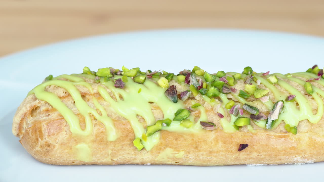 White eclair dessert with fistic nuts and cream