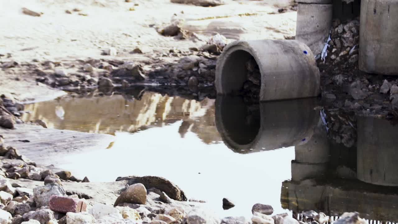 Concrete Drainage Pipe with Standing Water – Urban Runoff and Pollution Concept