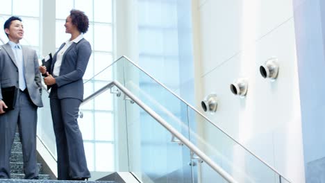 young multi ethnic businessman businesswoman using wireless technology