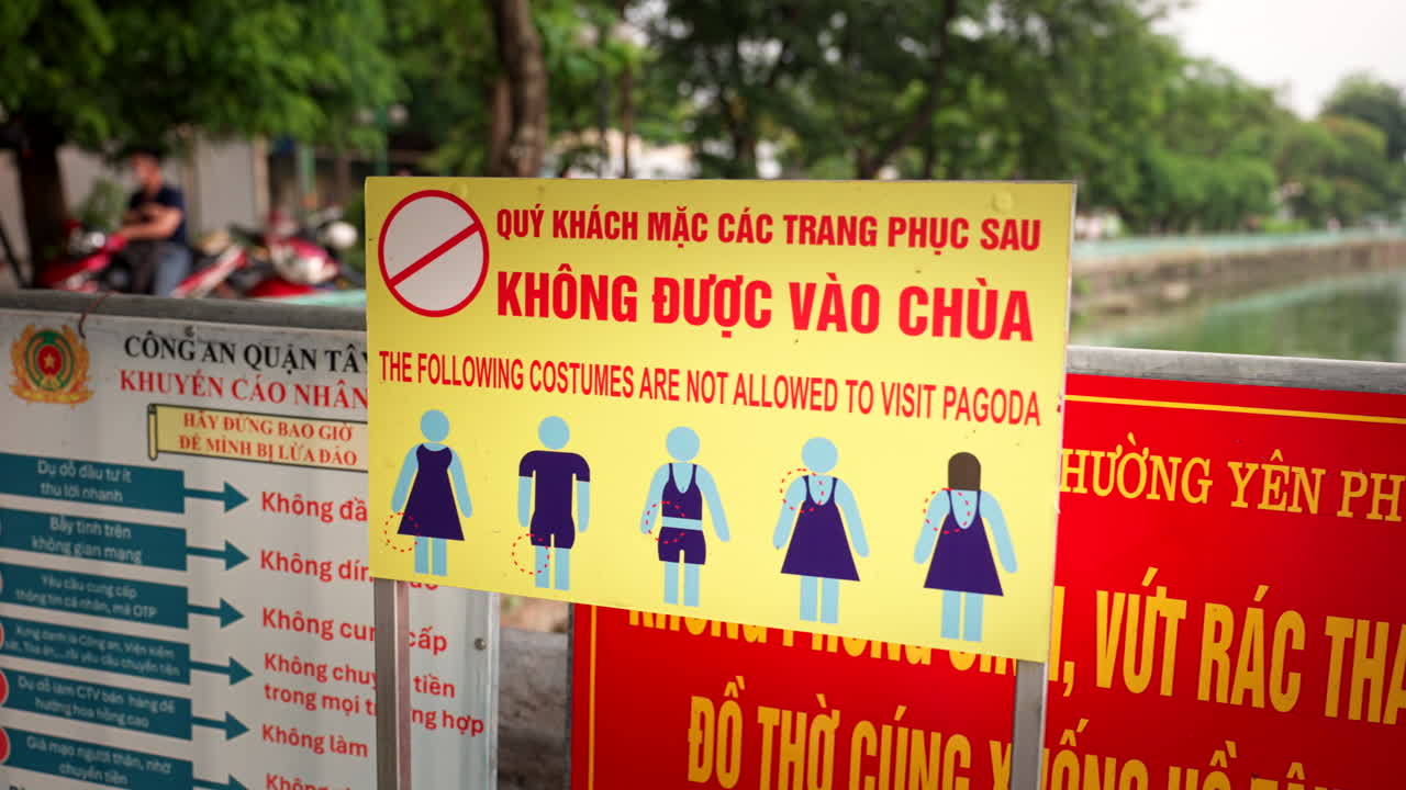 Vietnamese Rules On Prohibited Costumes In Visiting Pagoda In Hanoi, Vietnam. closeup shot