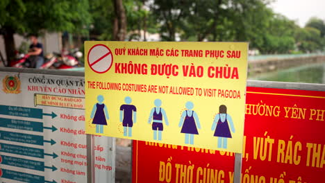 Vietnamese Rules On Prohibited Costumes In Visiting Pagoda In Hanoi, Vietnam. closeup shot