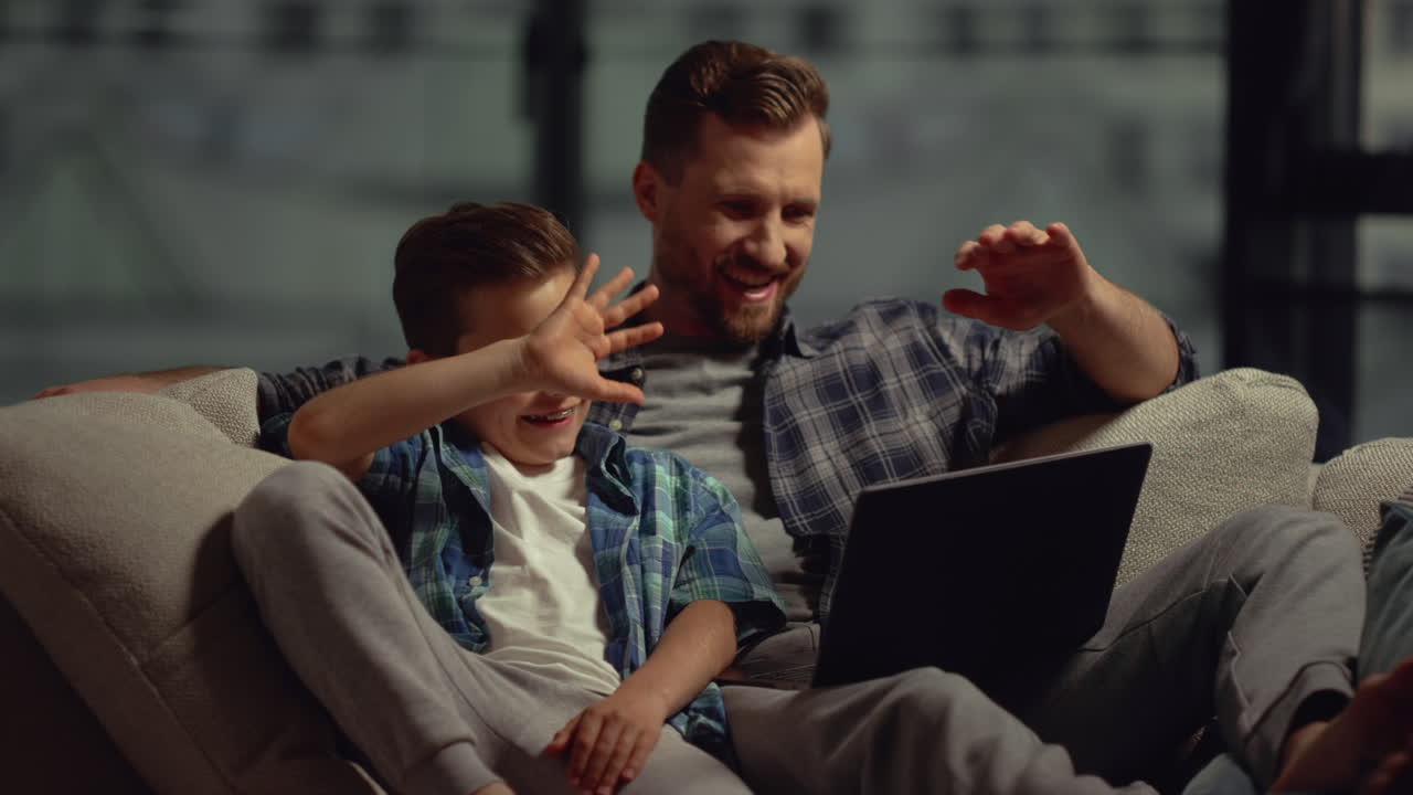 Free stock video - Dad and son having video call