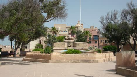 gardjola gardens park with trees, monument and bastion at senglea, malta