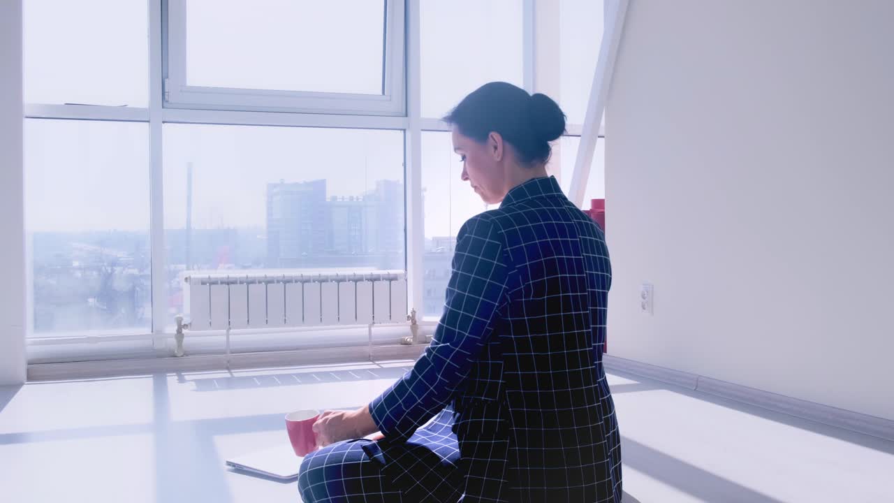 A Focused Individual Engaging in Mindful Work on a Laptop While Sitting Comfortably in a Serene and Bright Environment