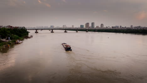 bridge iron beams with rusted grace, boat catches sunset’s warm embrace