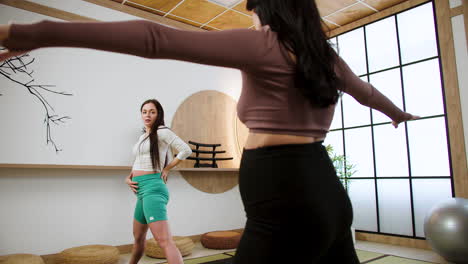 women doing yoga indoors