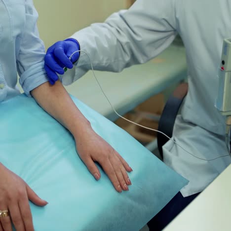 male doctor examining young woman. young doctor treating female patient in hospital