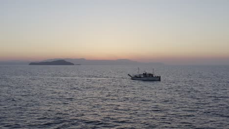 Aerial---Large-tourist-boat-cruising-in-Chania-Greece