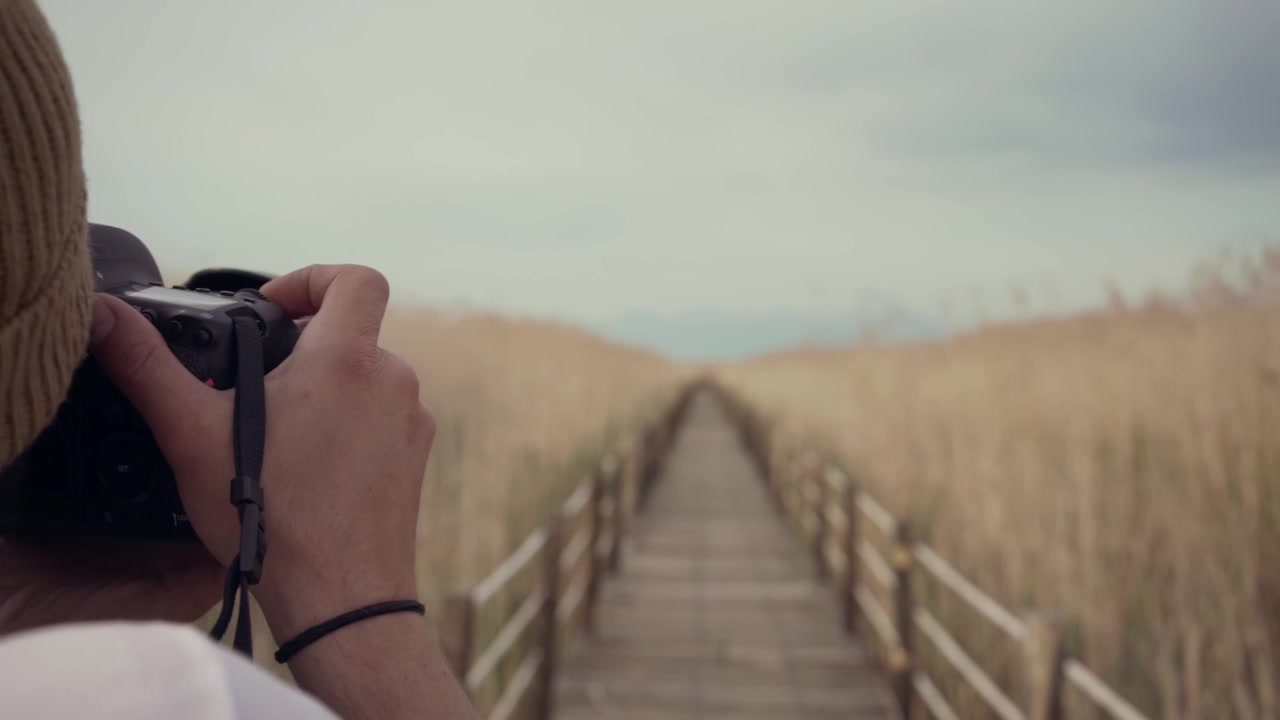 Photographer taking picture inside reeds