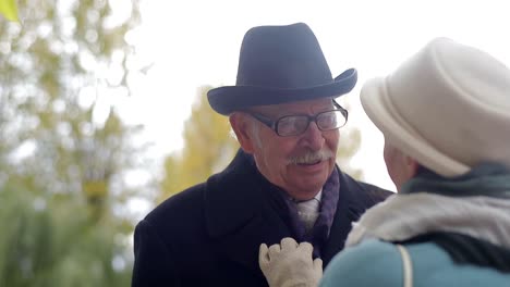 elderly couple sharing a tender moment outdoors