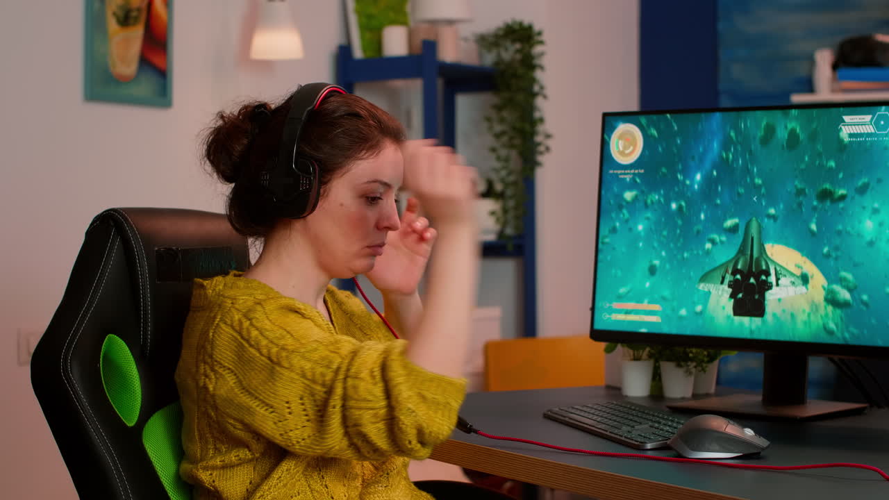 Shot of professional gamer playing space shooter online video game