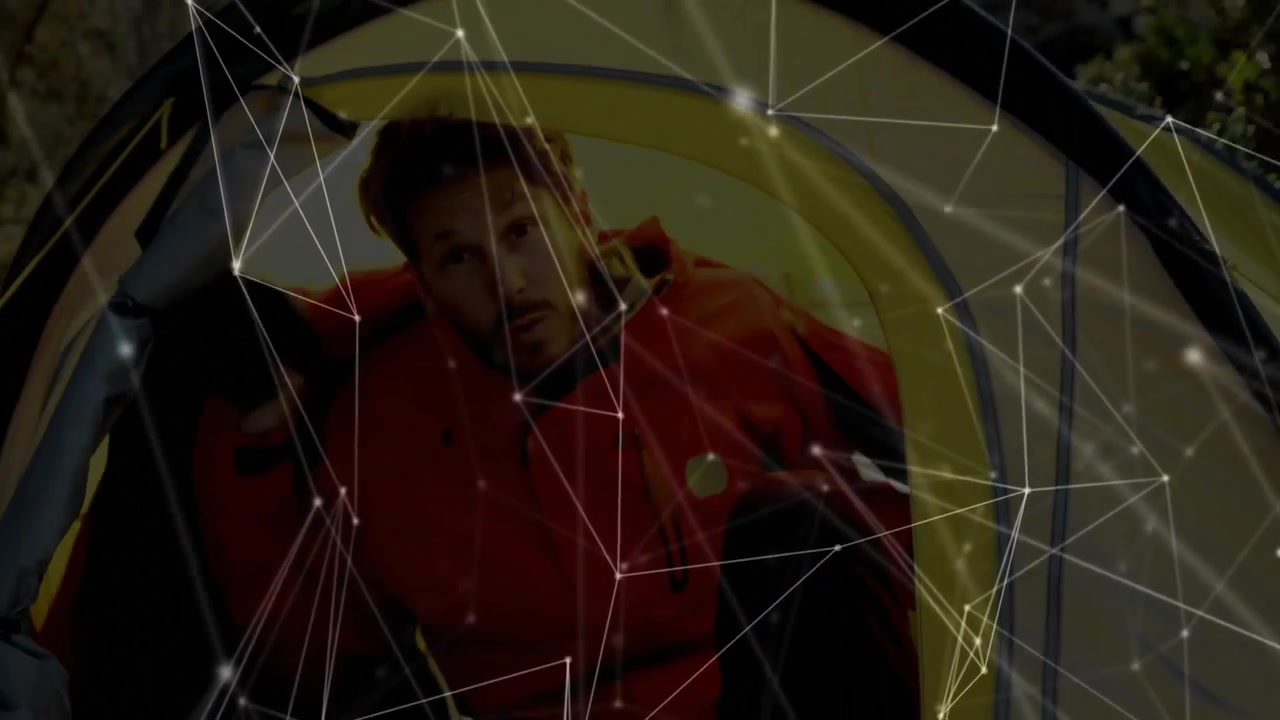 Camper reaching for red backpack inside yellow tent, unfolding puffy jacket and exiting for camping