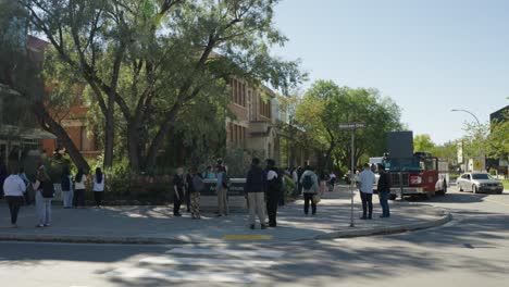 firetruck unloads firefighters as students evacuate dorm at university of manitoba during fall