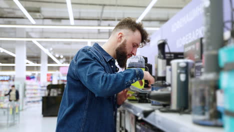 man shopping for kitchen appliances in a supermarket