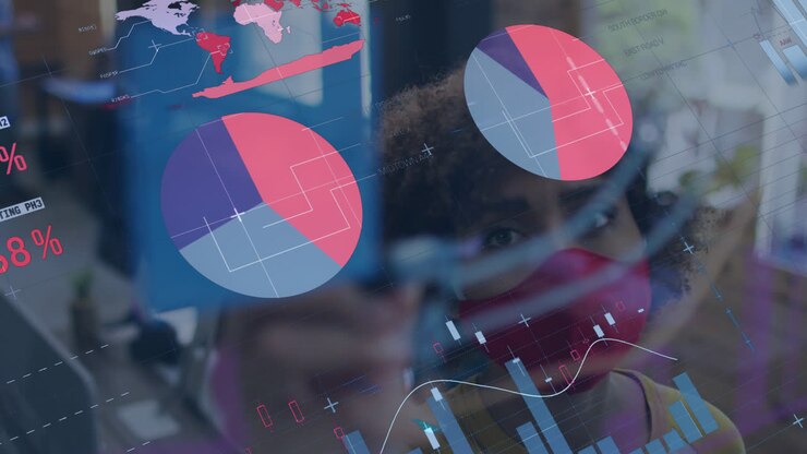 Animation of statistics recording over woman drawing in office wearing face mask